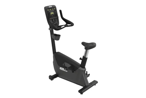 Black upright exercise bike with digital console display, padded seat, and stationary handlebars on white background
