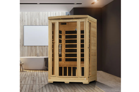Light wood two-person infrared sauna cabin with glass front door, interior wooden benches, and black heater elements visible 