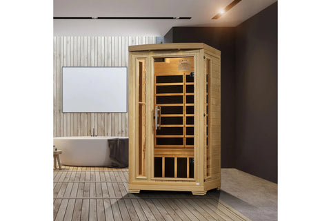 Natural wood infrared sauna cabin with glass front door, wooden bench seating, and metal handle on white background