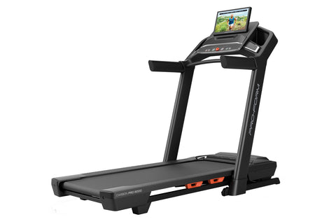 Black ProForm Carbon Pro 9000 treadmill with touchscreen display showing fitness video, padded running deck, and orange accen
