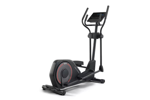 Black elliptical machine with red accent trim, digital display console, curved handles, and footplate on white background
