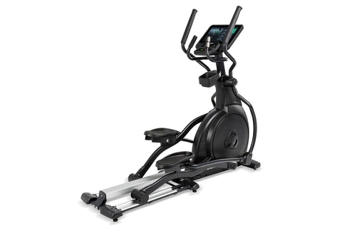 Black elliptical machine with digital console display, dual handles, and silver base frame on white background