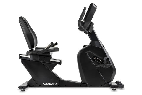 Spirit CR900 black recumbent exercise bike with digital console, padded seat, and foot pedals on white background