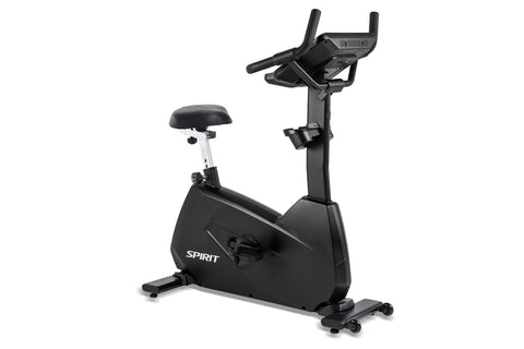 Spirit CU800ENT upright exercise bike with black frame, white seat, digital console with dual handles, and entertainment tabl