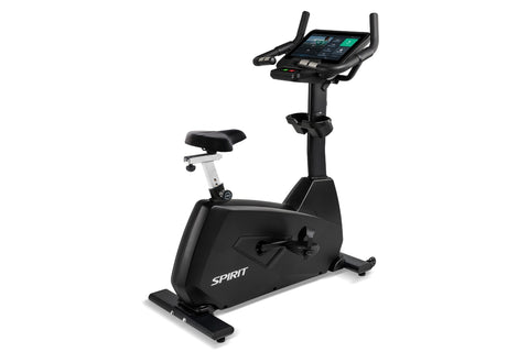 Spirit CU800ENT upright exercise bike with black frame, white seat, digital console with dual handles, and entertainment tabl