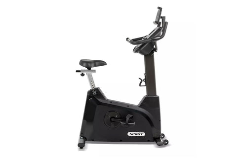 Spirit XBU55 upright exercise bike with black frame, digital console display, padded seat, and handlebars on white background