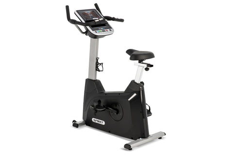 Spirit XBU55ENT upright stationary bike with black and silver frame, digital display console, adjustable black seat, and foot