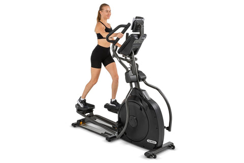 Black Spirit XE795 elliptical machine with digital console, dual handles, and foot pedals on white background