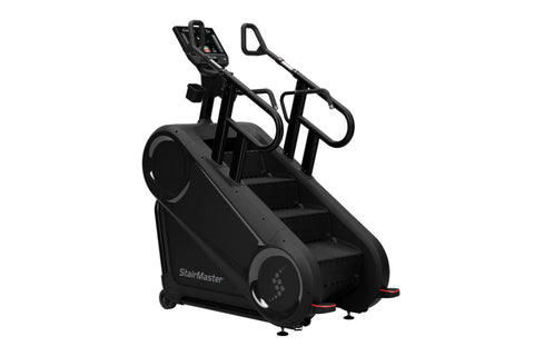 StairMaster Gauntlet 10G black stairclimbing machine with dual handles, digital console, and stepped platform on white backgr