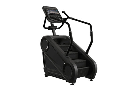 Black StairMaster Gauntlet 4G StepMill with digital display console, handrails, and stepped platform on white background