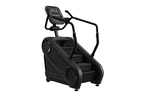 Black StairMaster Gauntlet 4G StepMill with digital display console, handrails, and stepped platform on white background