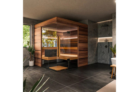 Thermasol Astra indoor sauna with warm wood exterior, glass doors, and bench seating in modern bathroom setting