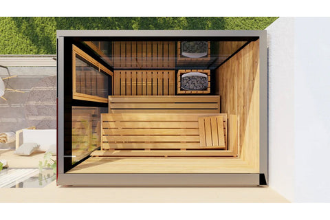 Black outdoor sauna with glass doors on modern patio, surrounded by green trees and contemporary furniture