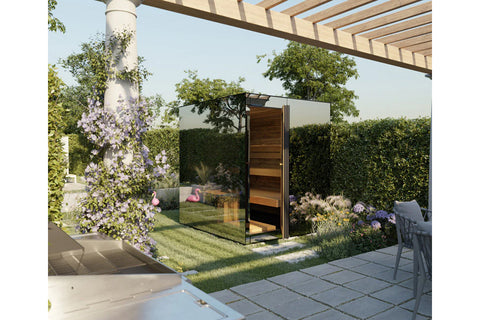 Modern outdoor sauna with glass and wood panels, black metal frame, wooden interior, set in garden with purple flowering vine