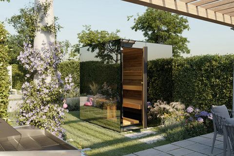 Modern outdoor sauna with glass and wood panels, black metal frame, wooden interior, set in garden with purple flowering vine