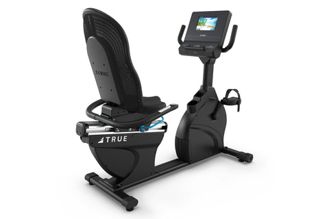 Black recumbent exercise bike with mesh backrest, digital display console, and foot pedals on white background