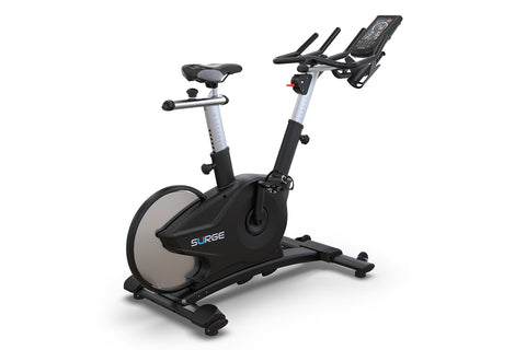 Black and silver upright exercise bike with digital display console, handlebars, and cushioned seat on white background