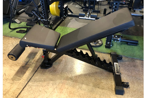 Black and blue adjustable weight bench with padded seat and backrest, sturdy metal frame, displayed in gym setting