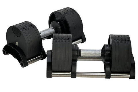 Pair of black adjustable dumbbells with metal handles and weight plates, shown in flat lay on white background