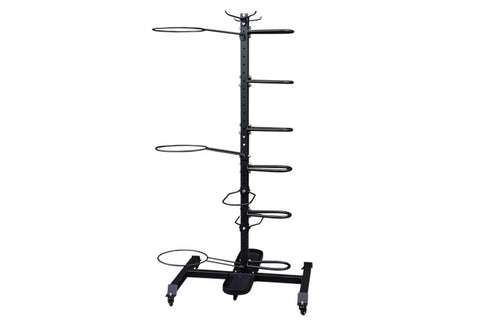 Black metal multi-tier accessory storage rack with vertical pole, horizontal arms, and wheeled base on white background