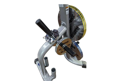 Warrior chrome Olympic weight plates stacked vertically on rack showing 25lb, 35lb, and 45lb plates with black handles on whi