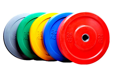 Warrior Olympic color bumper plate set in light blue, black, green, yellow, blue, pink, and red with weight markings, arrange