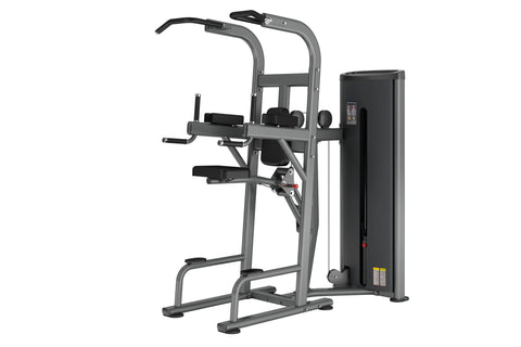 Gray and black commercial assisted chin dip machine with overhead pull handles, foot platform, and weight stack on white back