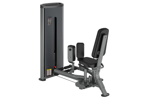 Warrior Deluxe Commercial Hip Abduction Adduction machine with gray frame, black seat and back pad, dual resistance arms, on 
