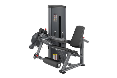 Warrior Deluxe Commercial Series leg curl extension machine with dark gray frame, padded seat and leg rest, on white backgrou