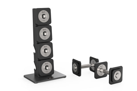 Black and silver Warrior D22.5 adjustable dumbbell set stacked on base stand, flat lay on white background