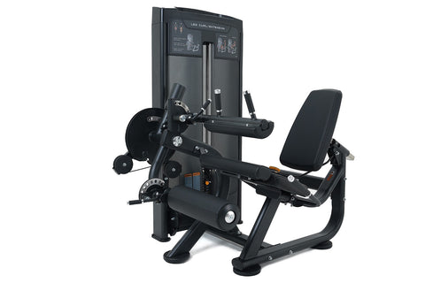 Black commercial leg curl and extension machine with padded seat, weight stack, and instruction panel on white background