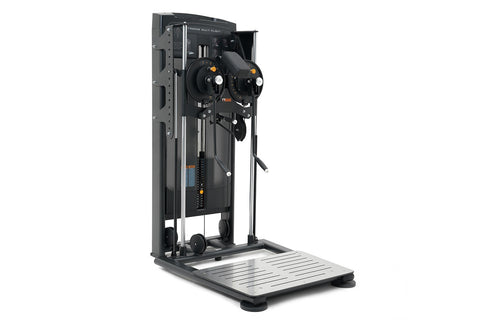 Black and gray commercial standing flight trainer with dual control wheels, digital display, and metal footplate on white bac