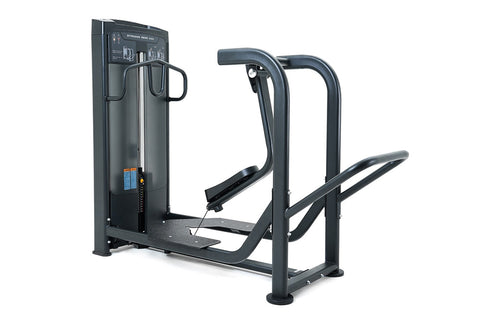 Black commercial standing rear kick machine with padded footplate and curved handles on white background