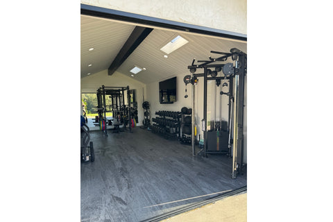 Gunmetal grey marble-textured interlocking gym tile with subtle veining on white background