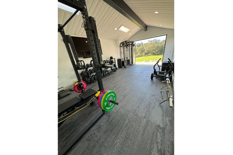 Warrior Marble Interlocking Gym Tile in stone grey with textured surface and interlocking edges, flat lay view