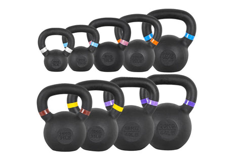 Set of nine black powder-coated kettlebells with colored weight bands in increments from 4kg to 24kg, displayed on white back