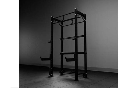 Black modular power rack with pull-up bar, blue barbell with weights loaded, storage shelves holding dumbbells and colored we