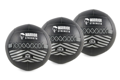Three black Warrior Strength wall balls with white skull logo and chevron stripe design, labeled 8LB, 10LB, and 12LB