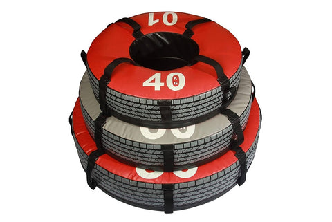 Three weighted exercise tires in gray 60 lb, red 90 lb, and red 40 lb sizes, each held by a model demonstrating use on white 