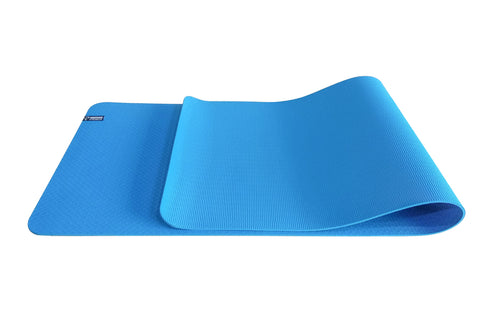 Blue foam yoga mat with textured non-slip surface, partially rolled, showing ribbed and smooth sides on white background
