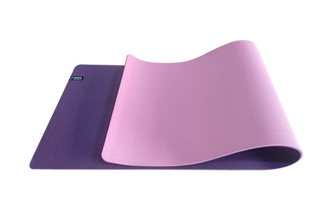Warrior Yoga Exercise Mat in reversible purple and pink ribbed rubber, shown rolled and partially unfolded on white backgroun