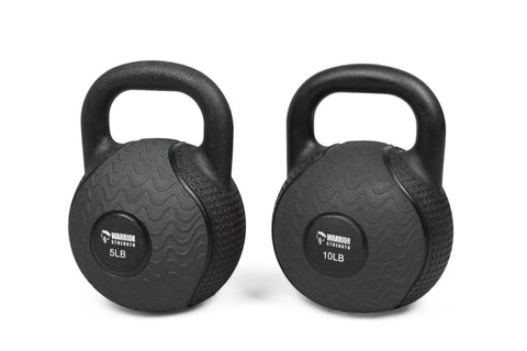 Two black rubber kettlebells with textured surfaces and looped handles, labeled 5LB and 10LB, displayed on white background