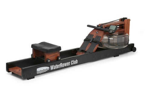 WaterRower Club rowing machine with dark wood frame, black base, water tank, and padded seat on white background