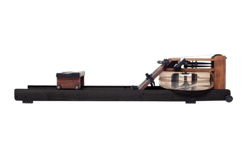 WaterRower Heritage rowing machine with black frame, wooden seat and footplate, and water resistance tank on white background