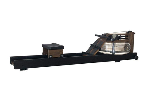 WaterRower Heritage rowing machine with black frame, wooden seat and footplate, and water resistance tank on white background