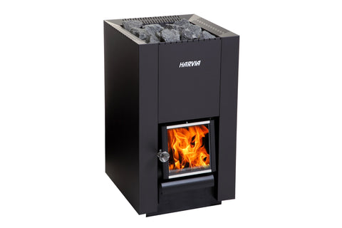 Harvia Linear 16 black wood-burning sauna stove heater with gray rocks in top chamber and visible flames in front door, on wh