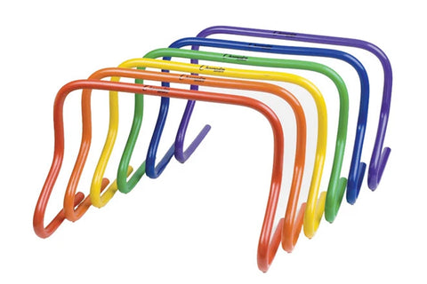Set of six multicolored speed hurdles in red, orange, yellow, green, blue, and purple stacked together on white background