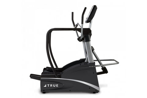 TRUE commercial elliptical with black frame, silver accents, dual handles, and foot pedals on white background