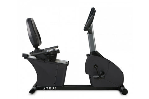 Black recumbent stationary bike with padded backrest, grey upright support, foot pedals, and digital console, shown on white 