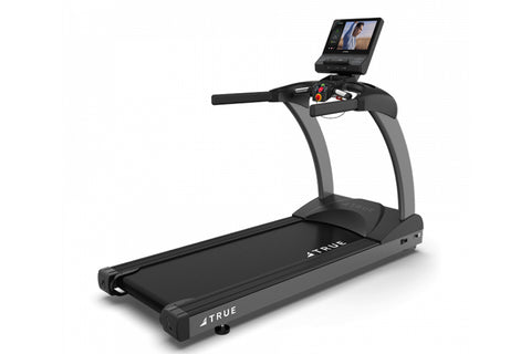 TRUE CS400 commercial treadmill with black running deck, gray frame, and touchscreen display mounted on console, on white bac
